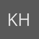 Kamillah Hanks avatar consisting of their initials in a circle with a dark grey background and light grey text.