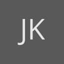 John Kaehny avatar consisting of their initials in a circle with a dark grey background and light grey text.