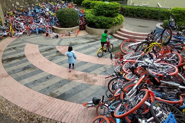 Abandoned bike-share bikes near the entrance of Xiashan park in Shenzhen. Photo: STR/AFP/Getty Images