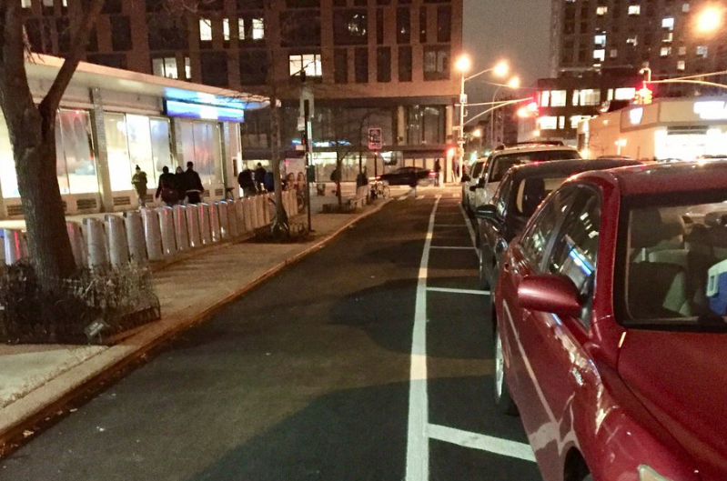 Clinton Street Protected Bike Lane Returns After Two-Month Hiatus