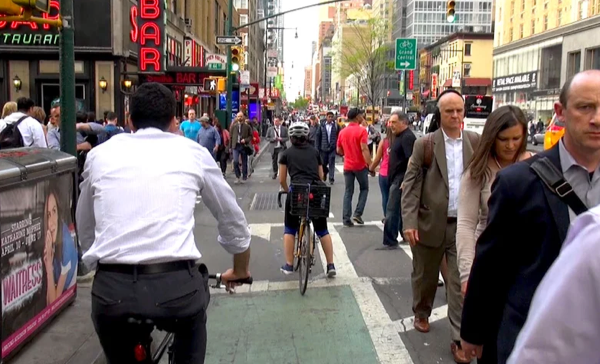 Why Does 8th Avenue Have 6 Lanes for Cars While People Are Crammed in the Margins?