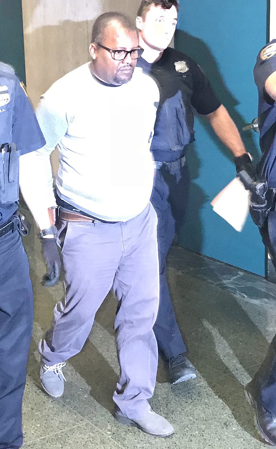 Bus driver Dave Lewis was led out in handcuffs to begin serving his 30-day sentence. Photo: Gersh Kuntzman
