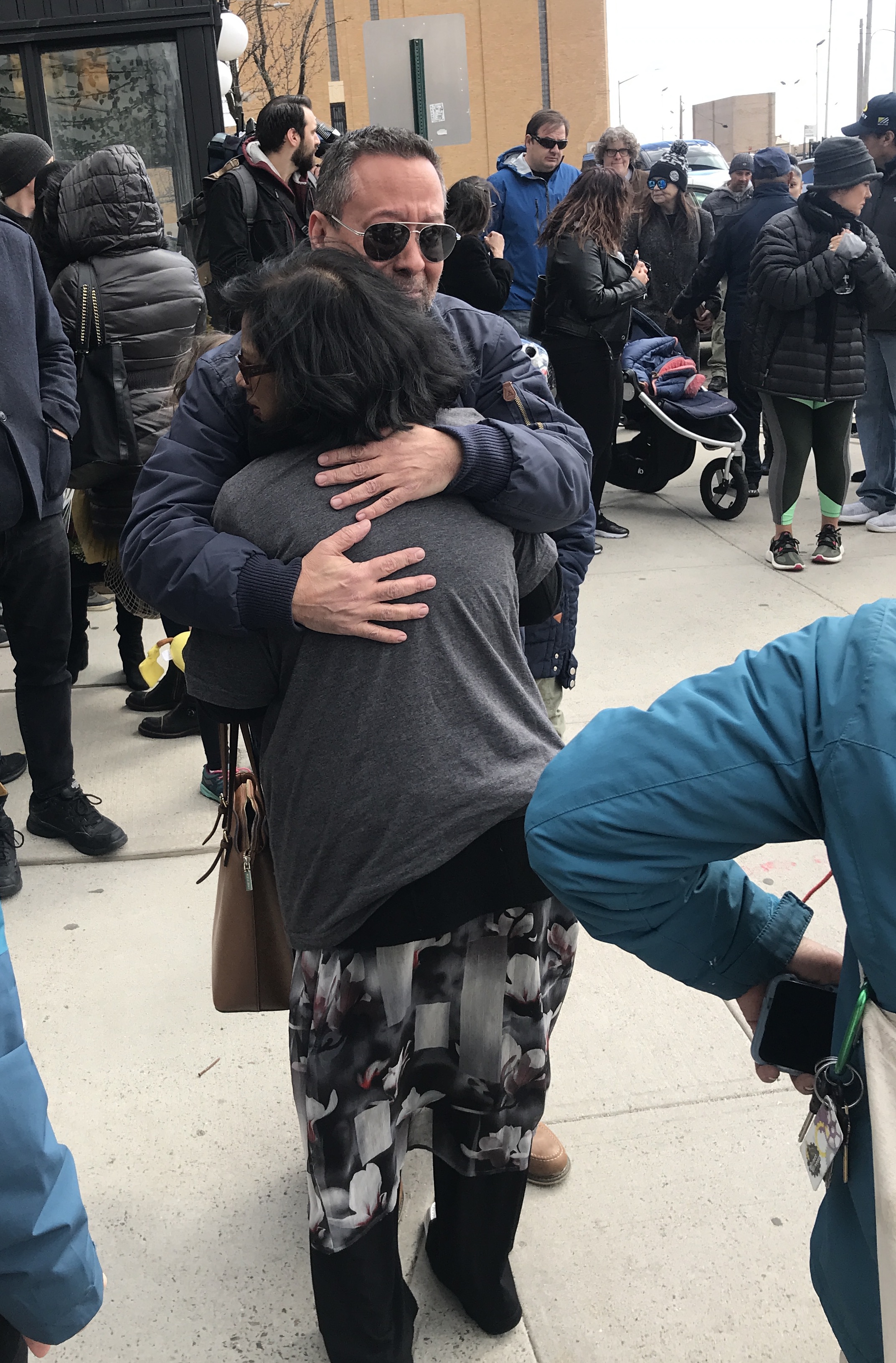 Michael Vega, the victim's friend, is consoled.