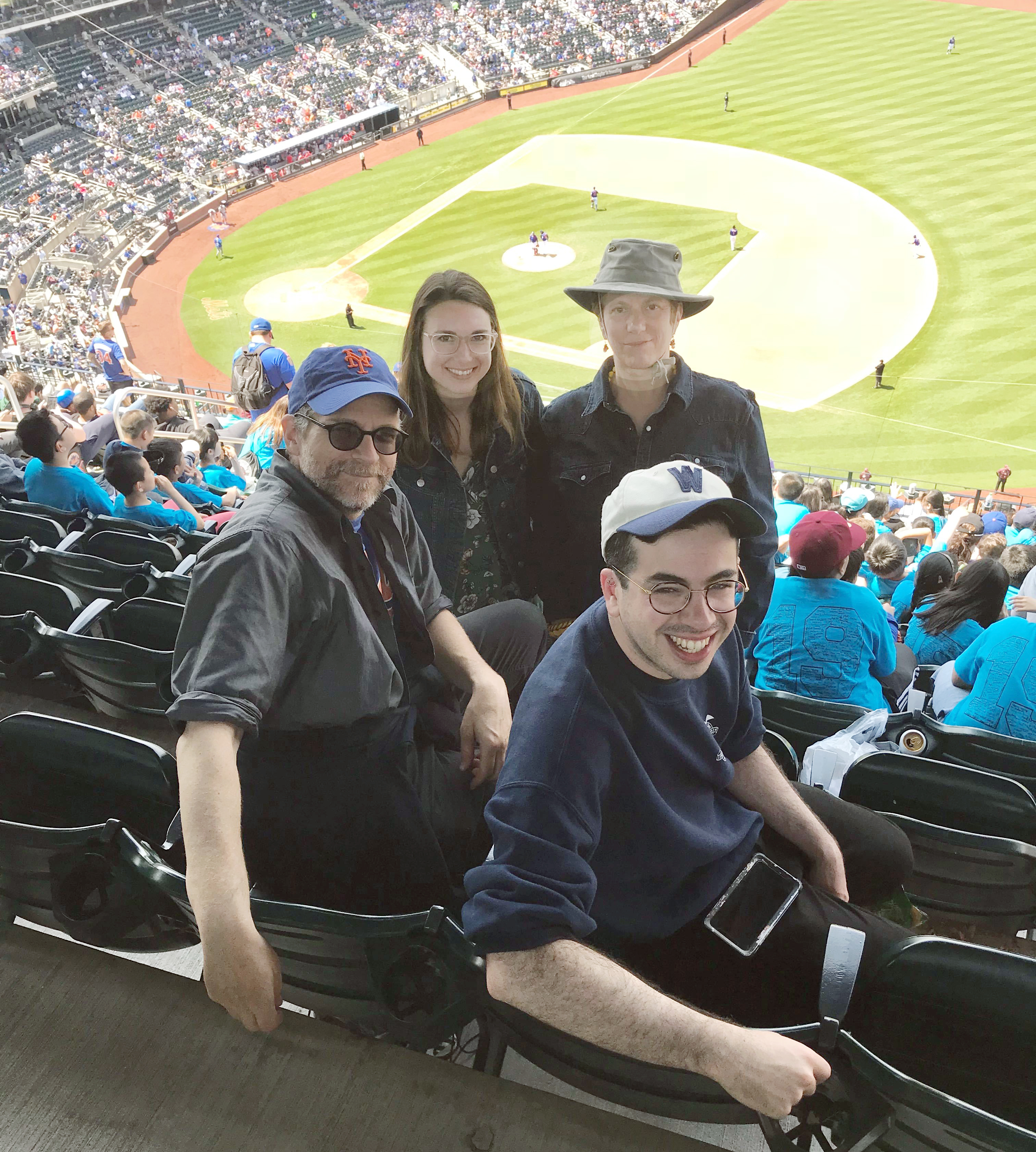 The Streetsblog team (from left) Editor Gersh Kuntzman, Reporter Julianne Cuba, Community Editor Eve Kessler and Senior Reporter David Meyer (in Senators hat) discussed many topics during its teambuilding trip to Citi Field on Thursday. Photo: Vince DiMiceli