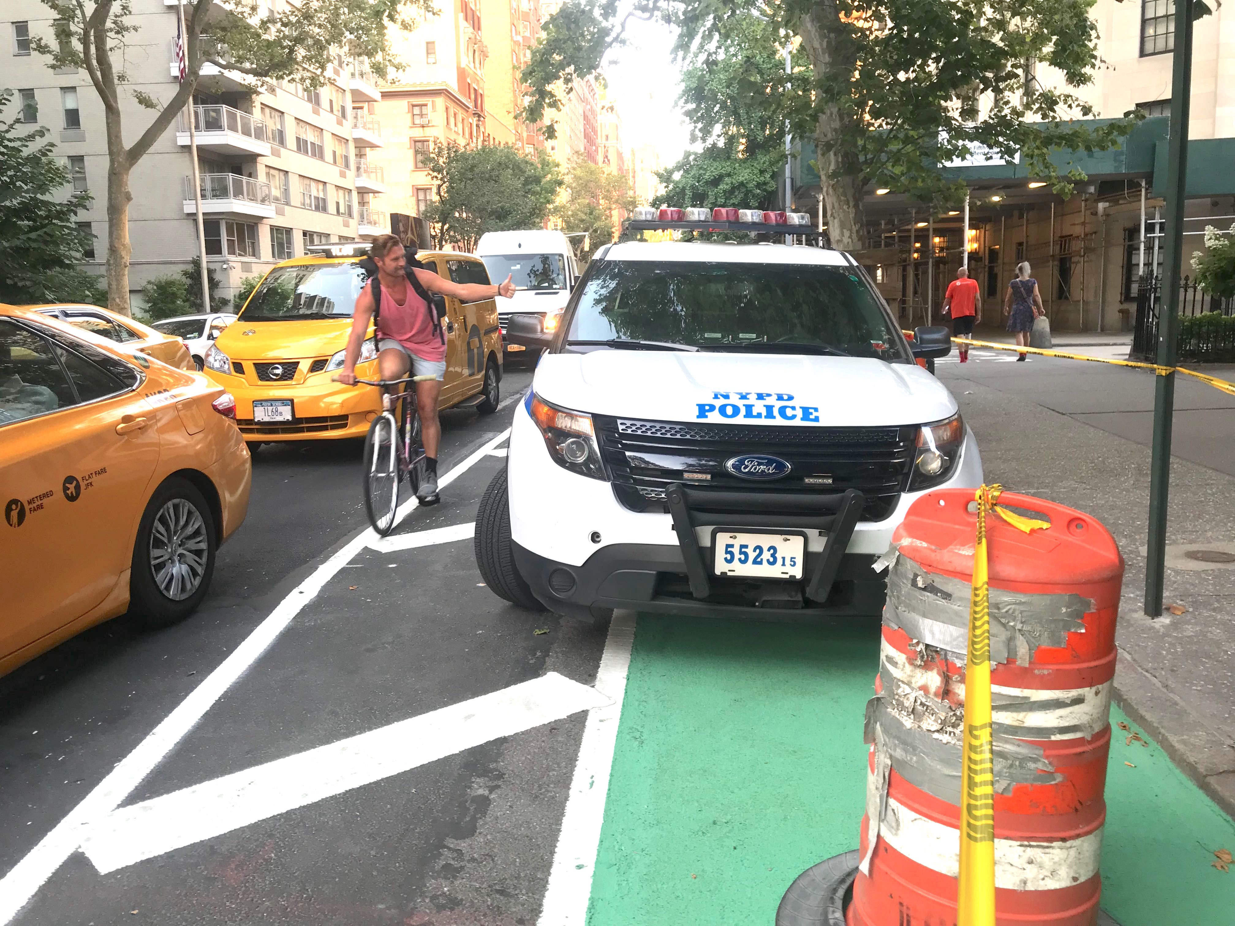A cyclist on Fifth Avenue