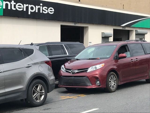 Cars stored in front of an Enterprise Rent-A-Car got parking tickets, but parking tickets were an otherwise rare sight. Photo by Dave Colon