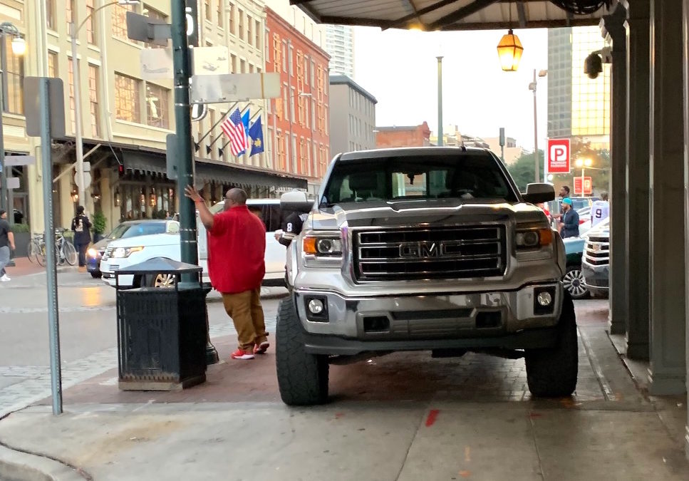 The monster truck even dwarfs a large man. Photo: Martha Roskowski