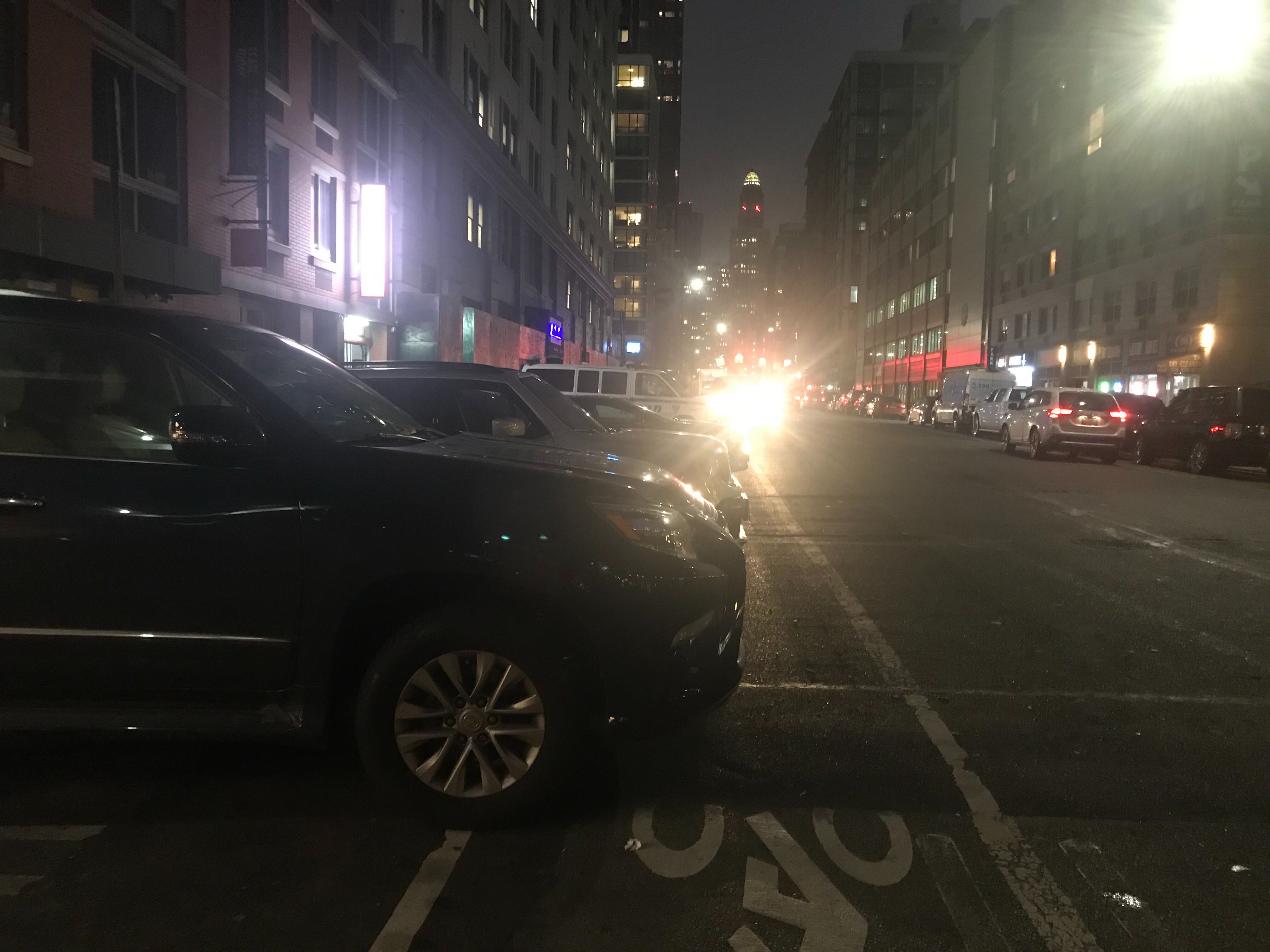 Cops cars parked in the bike lane on Monday night. Photo: Julianne Cuba