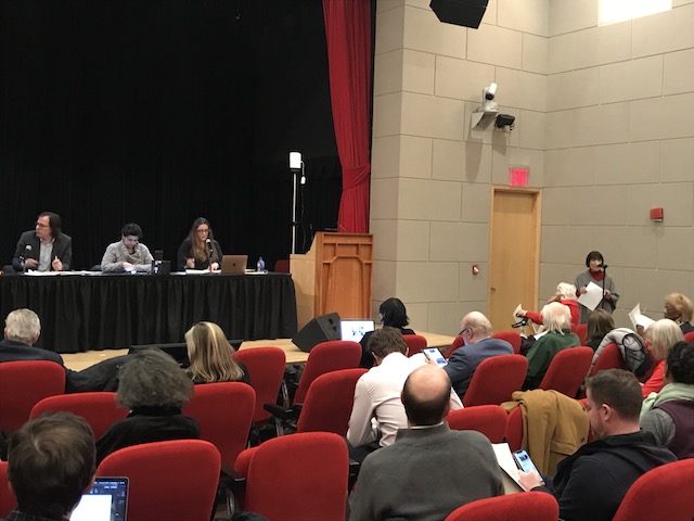 Shirley Secunda (at right, at the microphone) explains the curb reform resolution to Manhattan Community Board 2 on Thursday night. Photo: Dave Colon