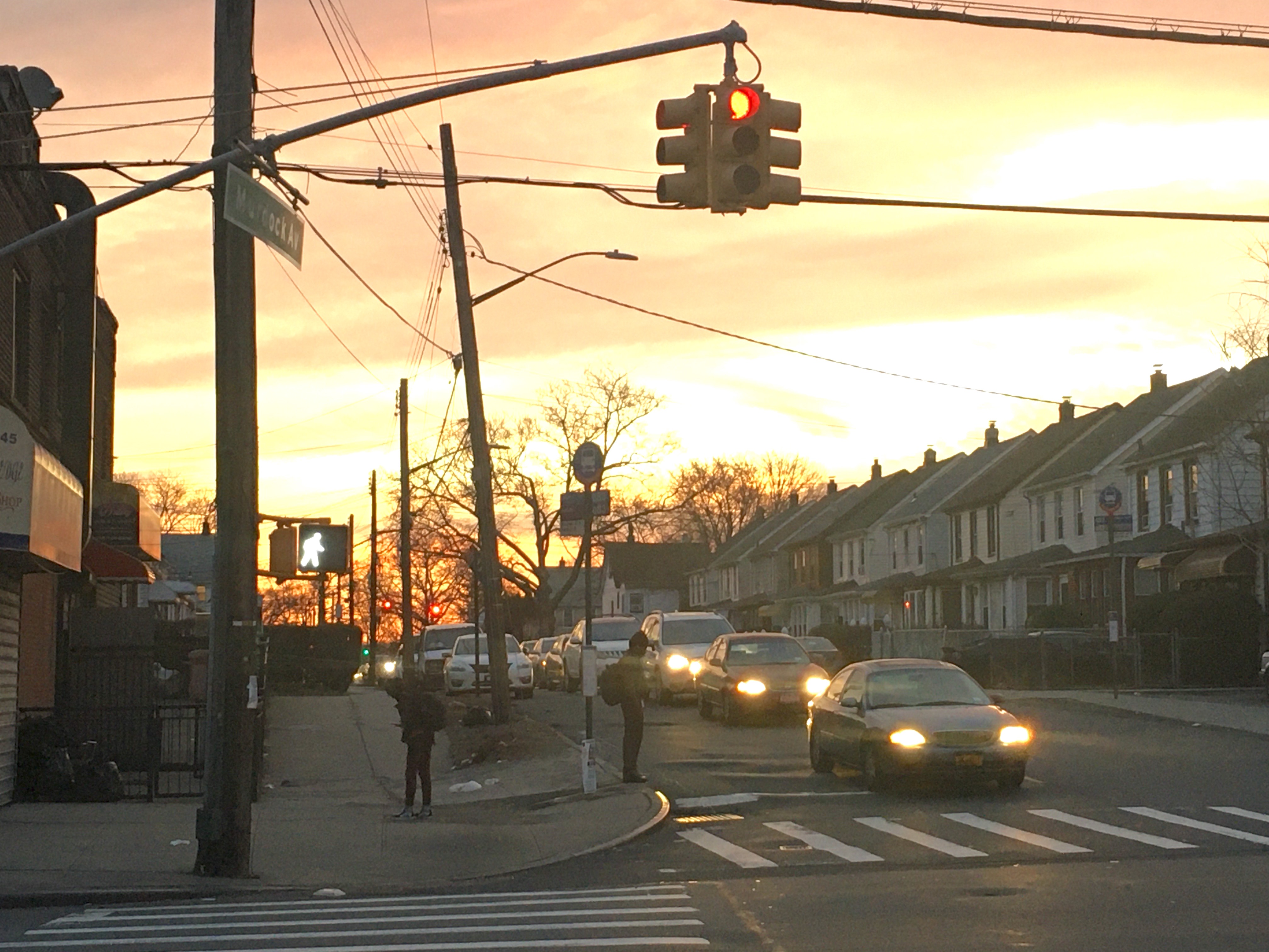 “Leading pedestrian intervals” in action: People on foot get a head start at a traffic light on Farmers Boulevard. Photo: Samuel Santaella