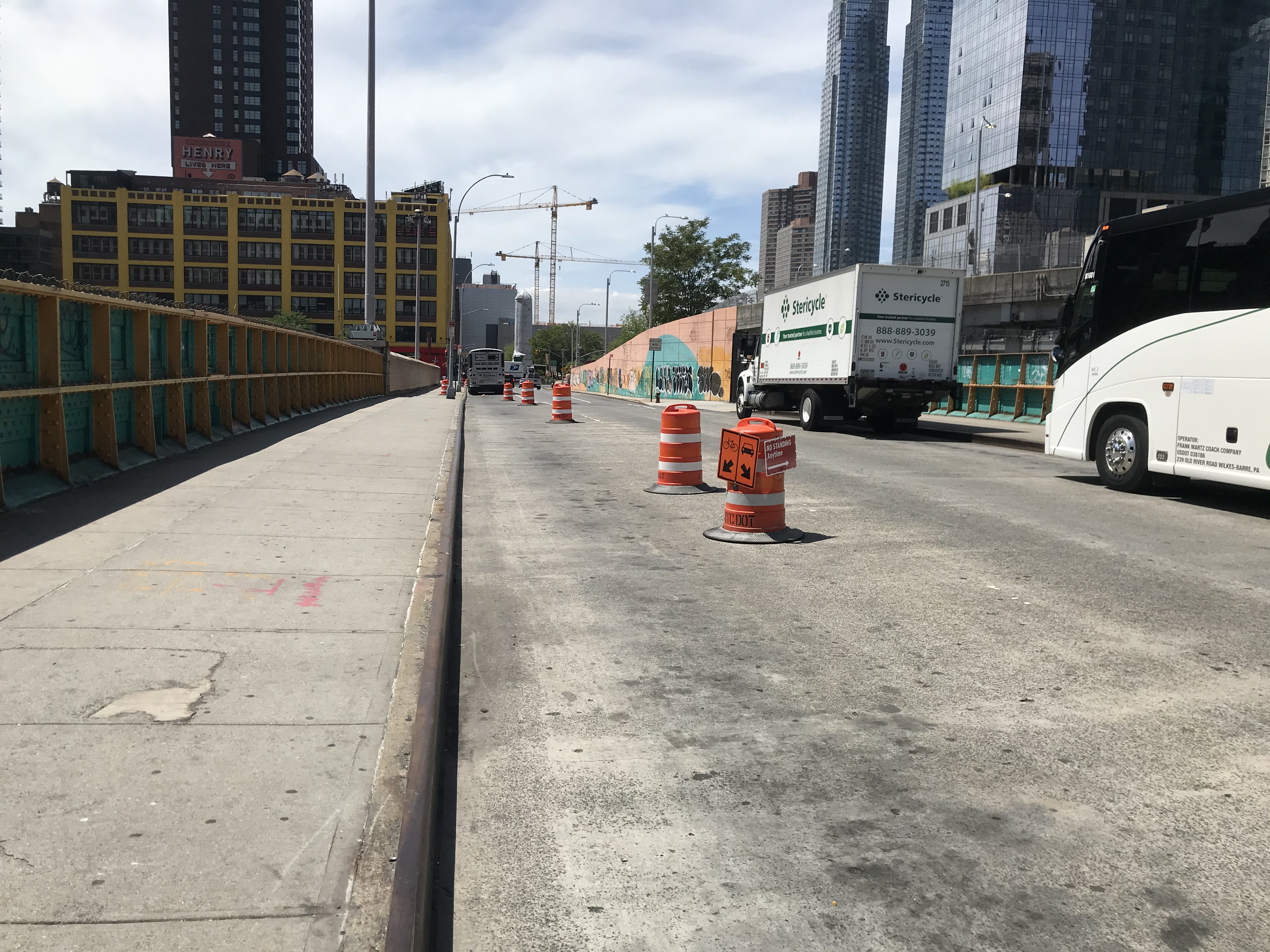 Barrels placed unevenly on 39th Street between 9th Avenue and 10th Avenue. Photo: Dave Colon
