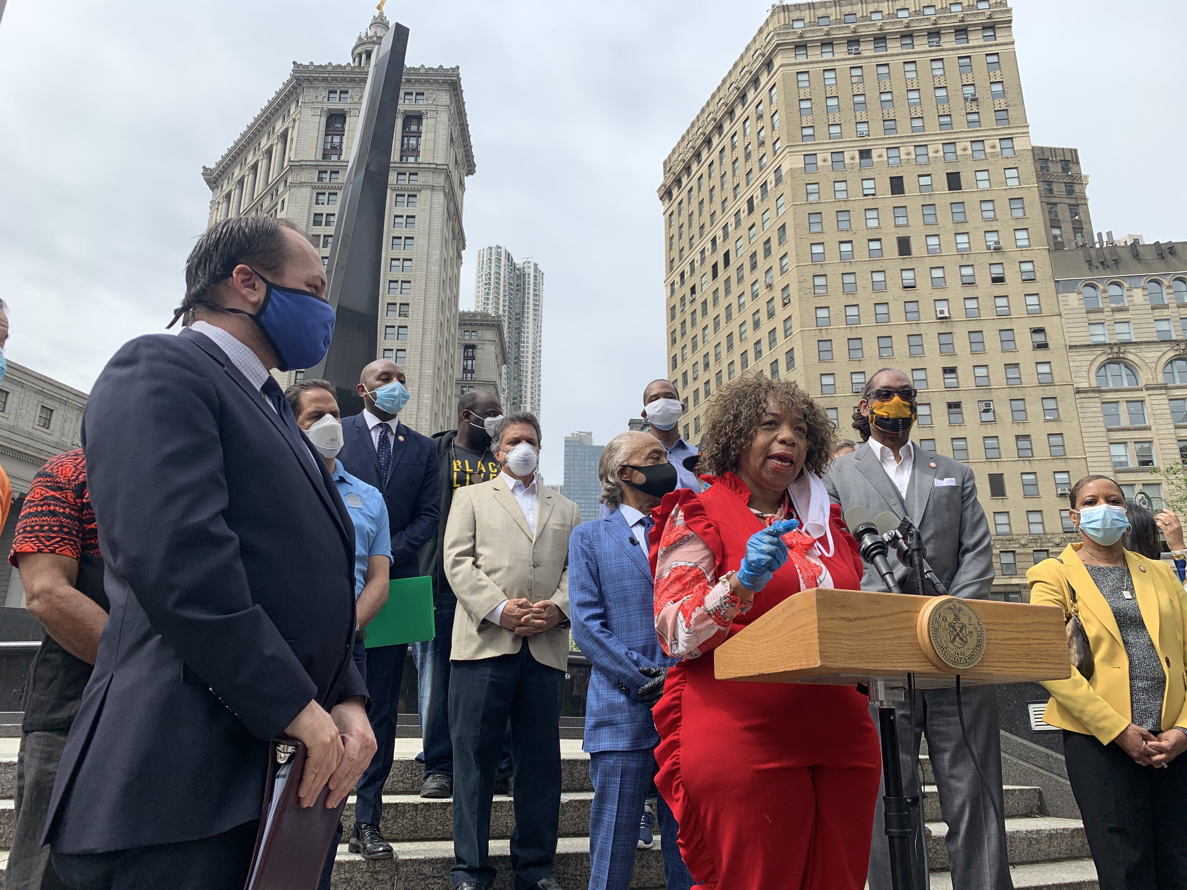 Council Speaker Corey Johnson looks on as Gwen Carr, the mom of Eric Garner, demands change. Photo: Gersh Kuntzman