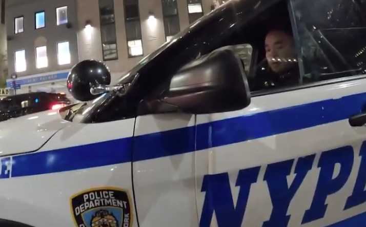 An officer rolls down his window to speak to Jeff Novich on Nov. 5.