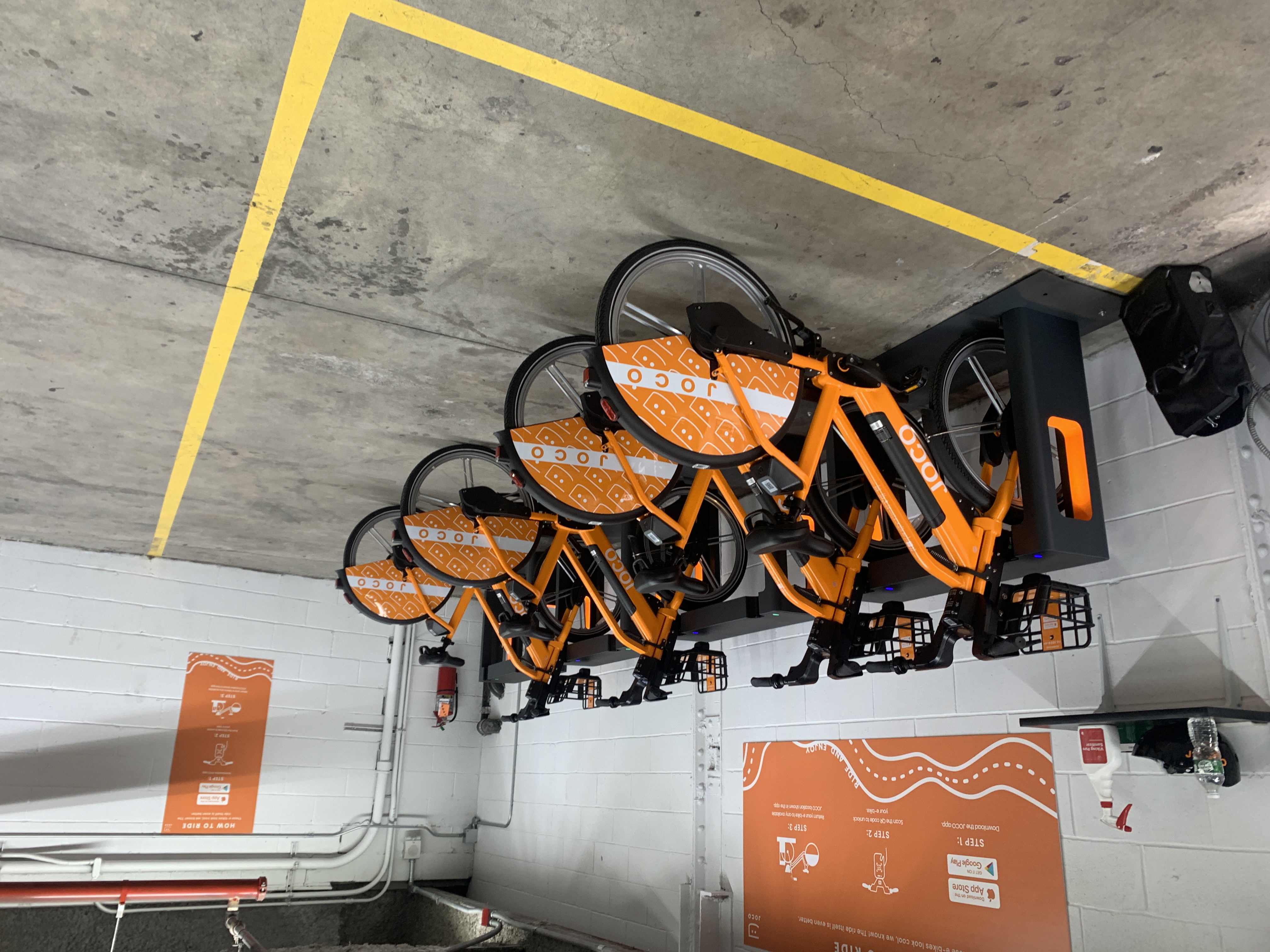 Legal parking? JOCO operates out of rented spaces in parking lots, not on city land, so the company thinks its bike share is legal.