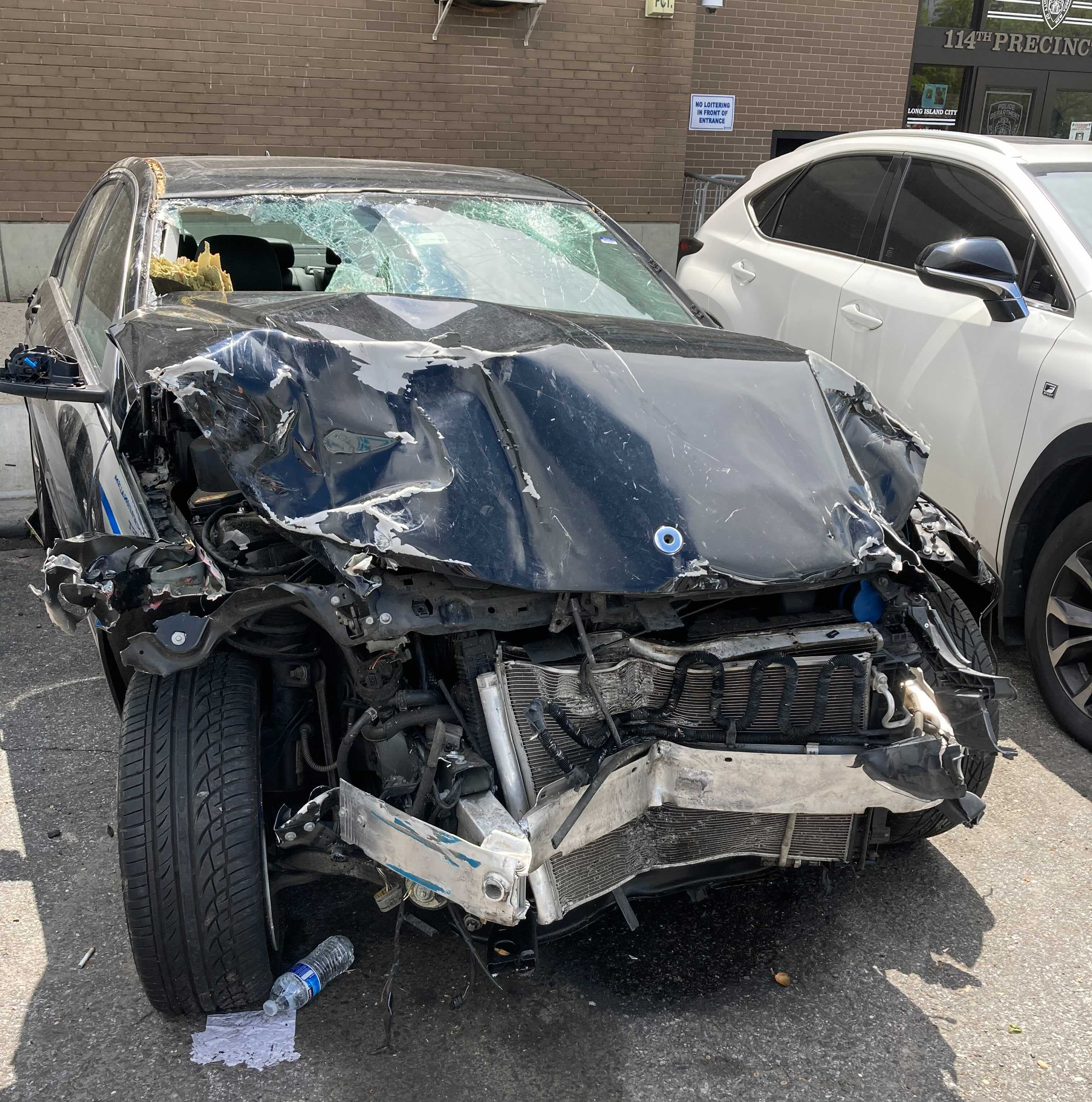The wreckage of the car that killed Xing Long Lin back in April in Astoria. Photo: Julianne Cuba