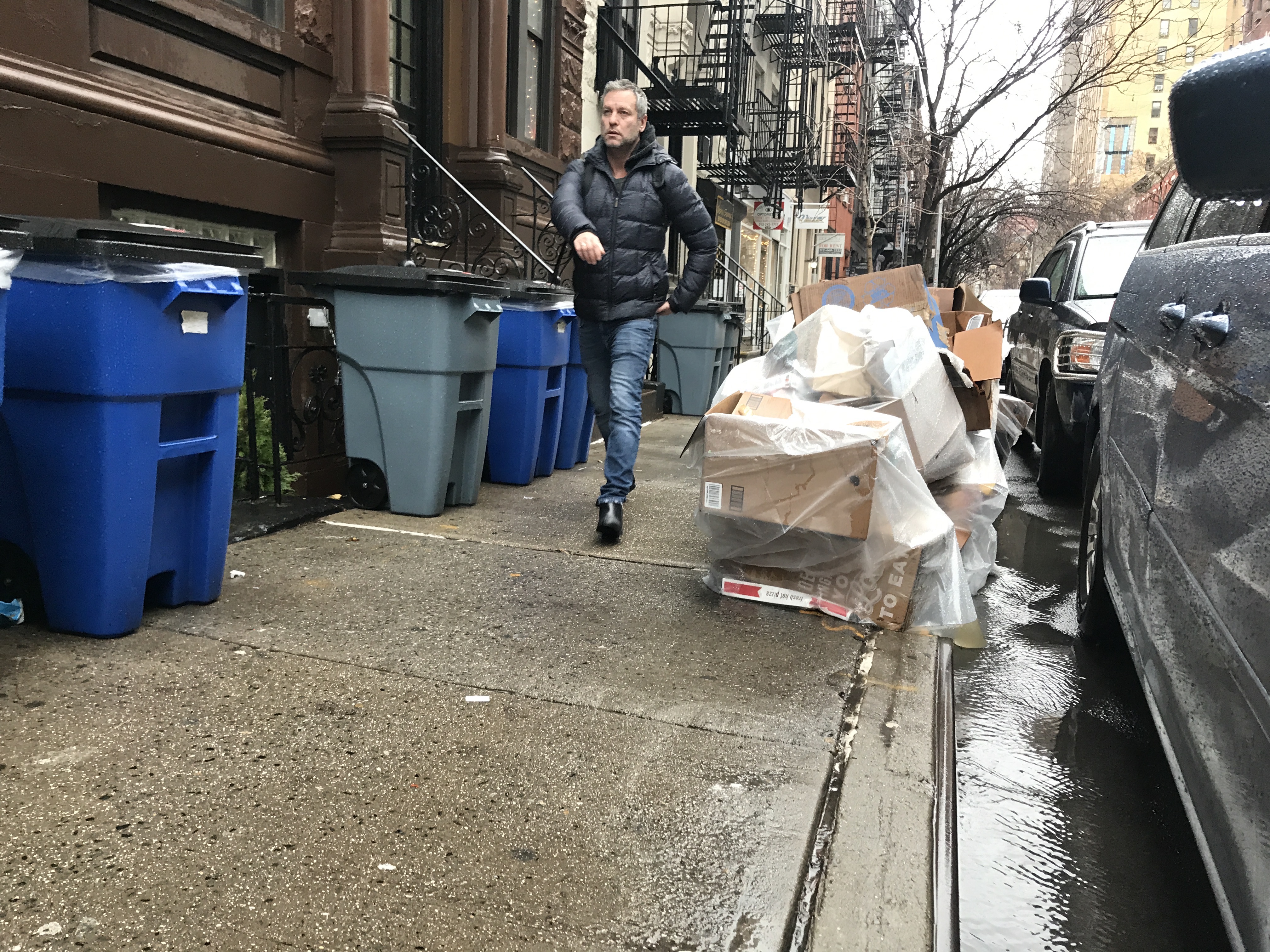 This is how most New Yorkers experience the sidewalk: squeezed between trash and building lines. File photo: Gersh Kuntzman
