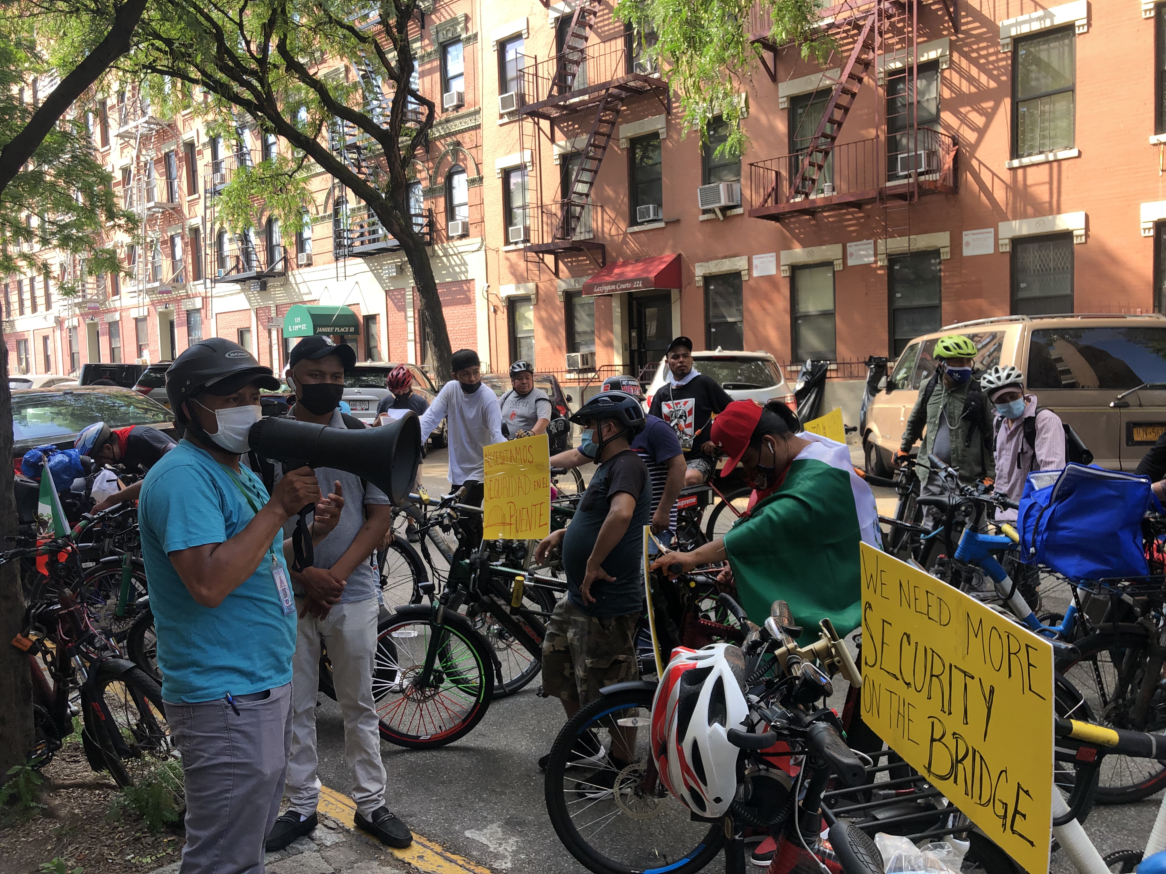 Sergio Salano speaking to crowd of delivery workers outside of 25th precinct. Photo: Fiifi Frimpong