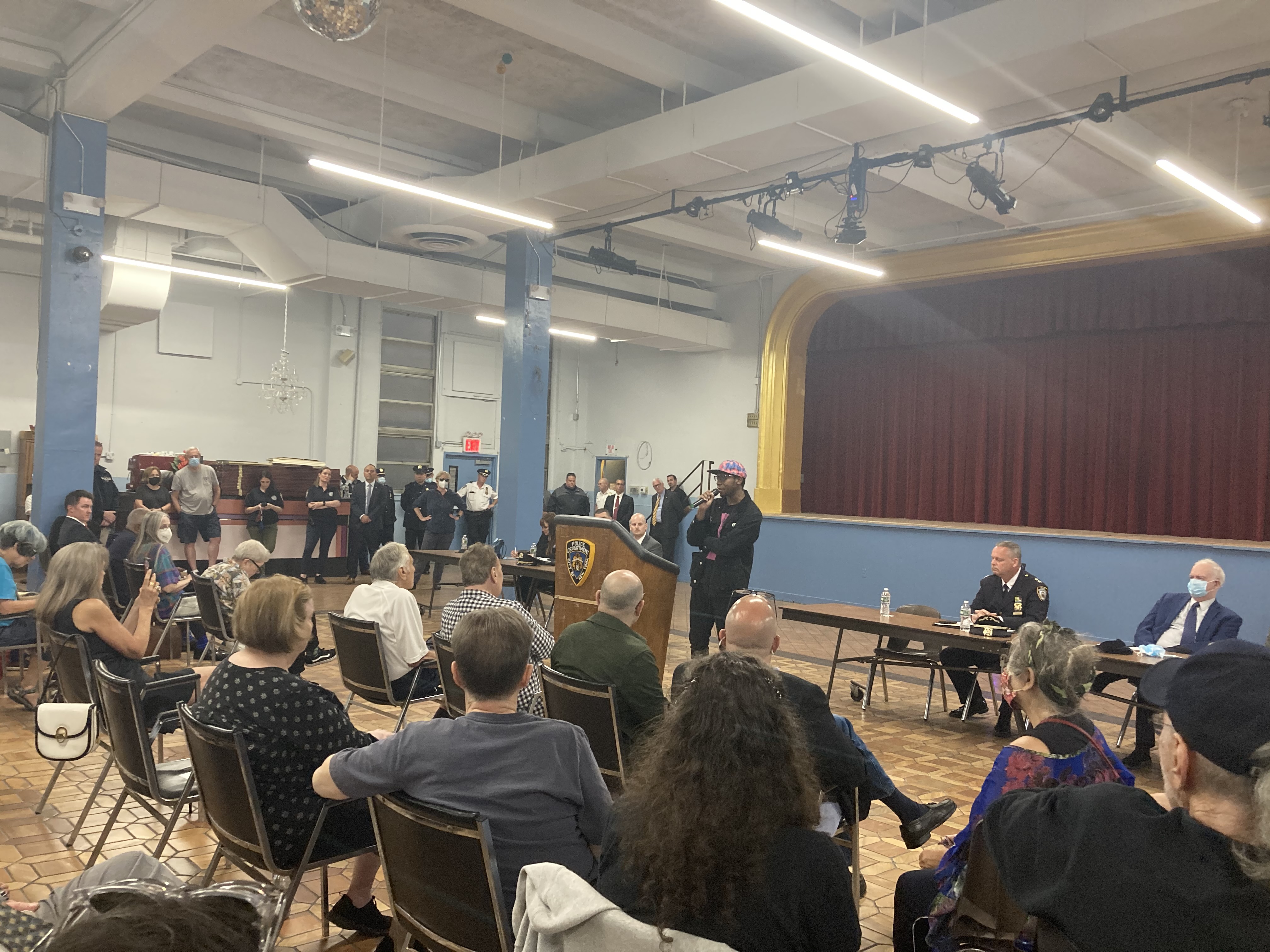 Aaron Gamman speaking during the meeting, defending the skateboards and musicians like him who use the park. Photo: Julianne Cuba