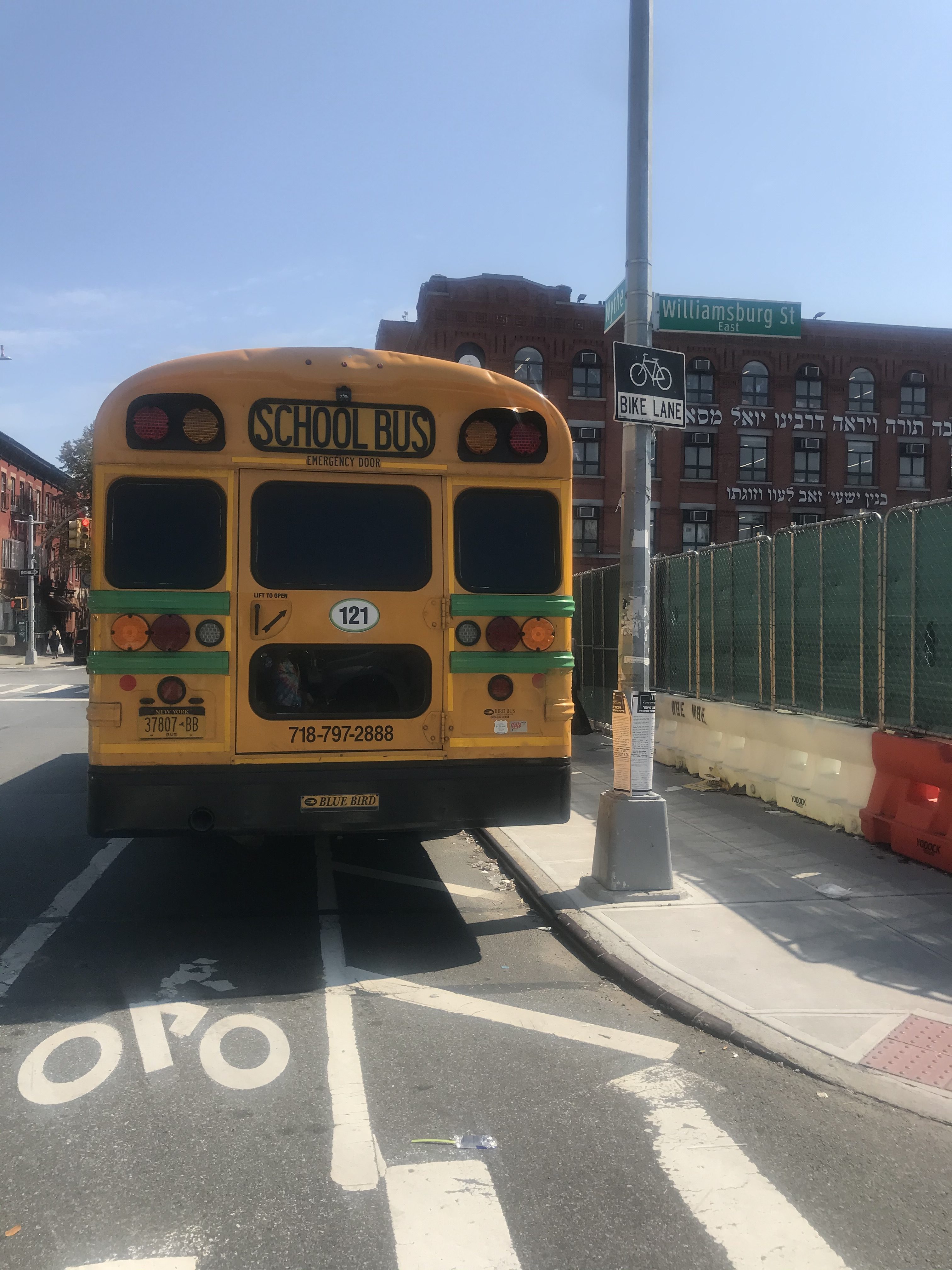 Buses persistently park in the bike lane. Photo: Julianne Cuba