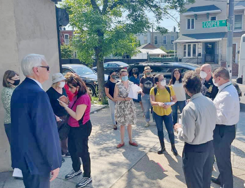 Council Member Bob Holden (far left) showed DOT and NYPD officials the dangers of Cooper Avenue back in May. Photo: Holden's office