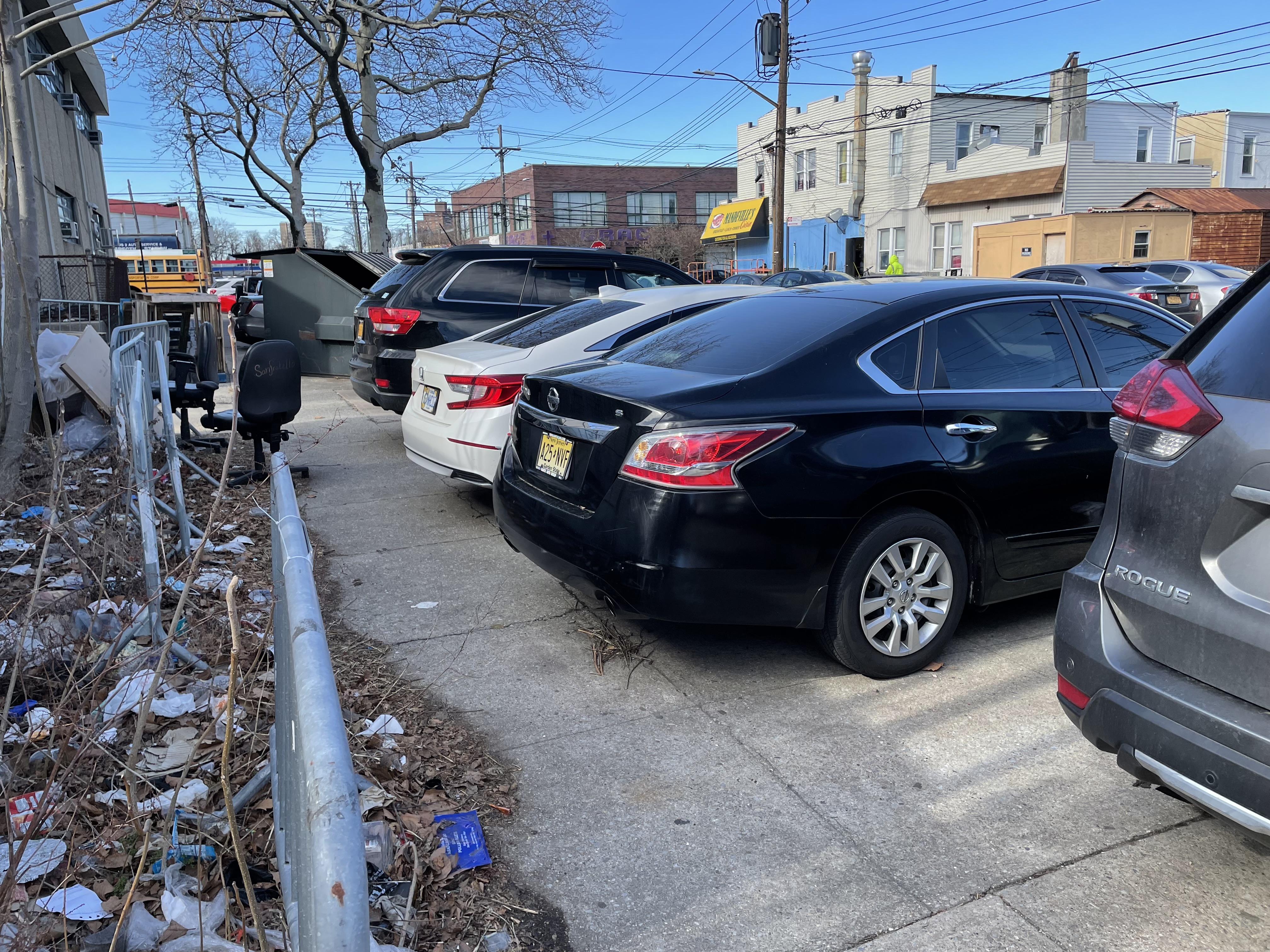 Barricades, unwanted office chairs, a garbage container and general unkemptness on East 98th Street. Photo: Dave Colon