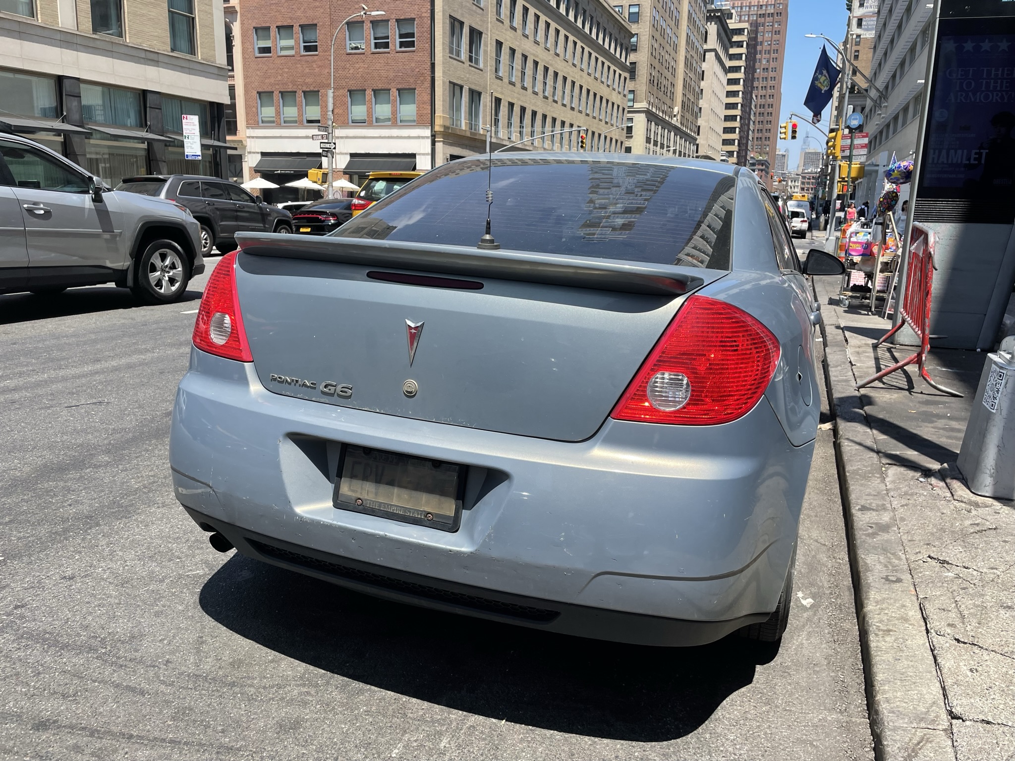 Federal Law Enforcement Placard on illegal license plate cover car