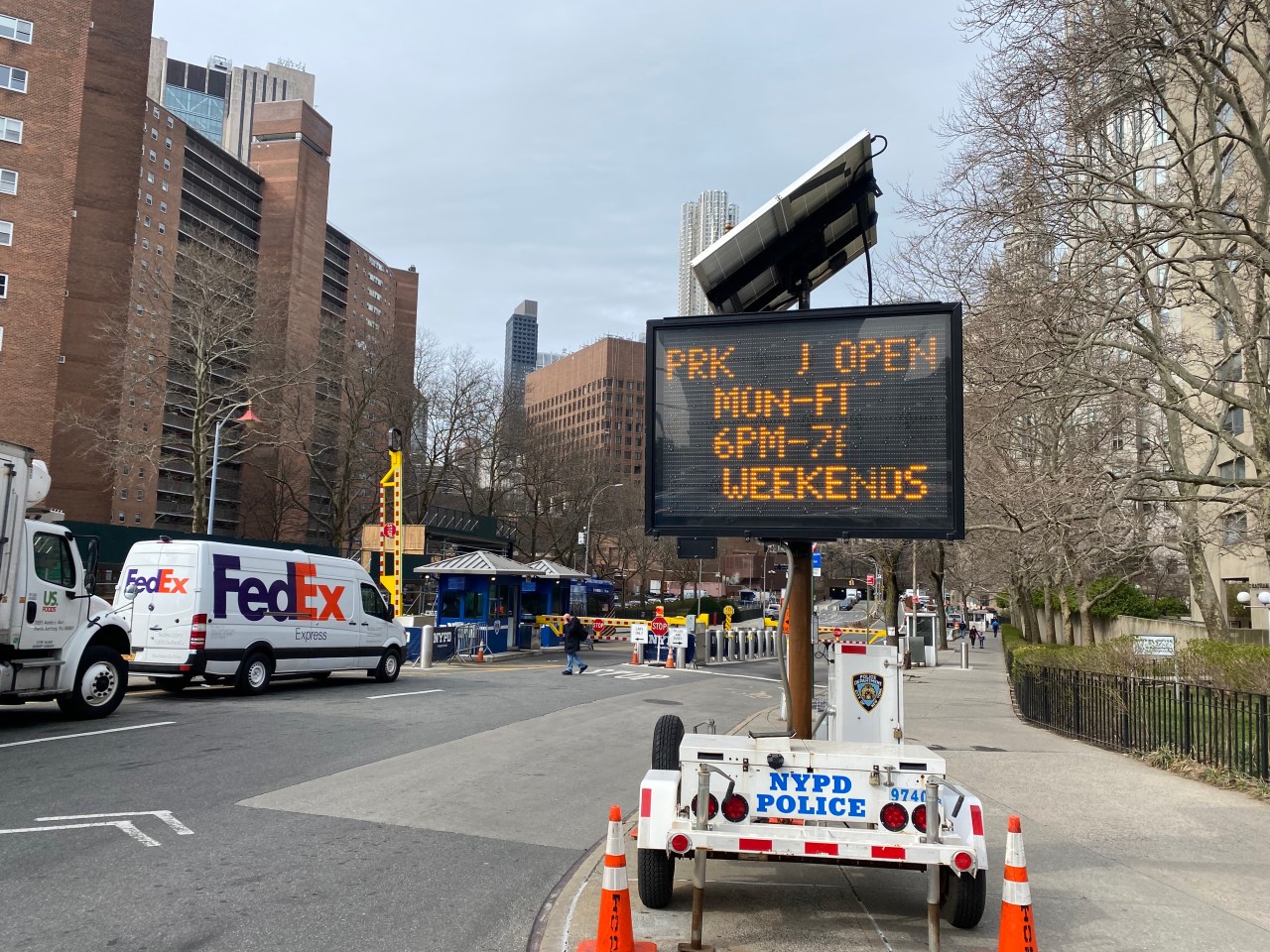 NYPD set up a sign Friday, March 31, saying the street would reopen on nights and weekends. Photo: Kevin Duggan