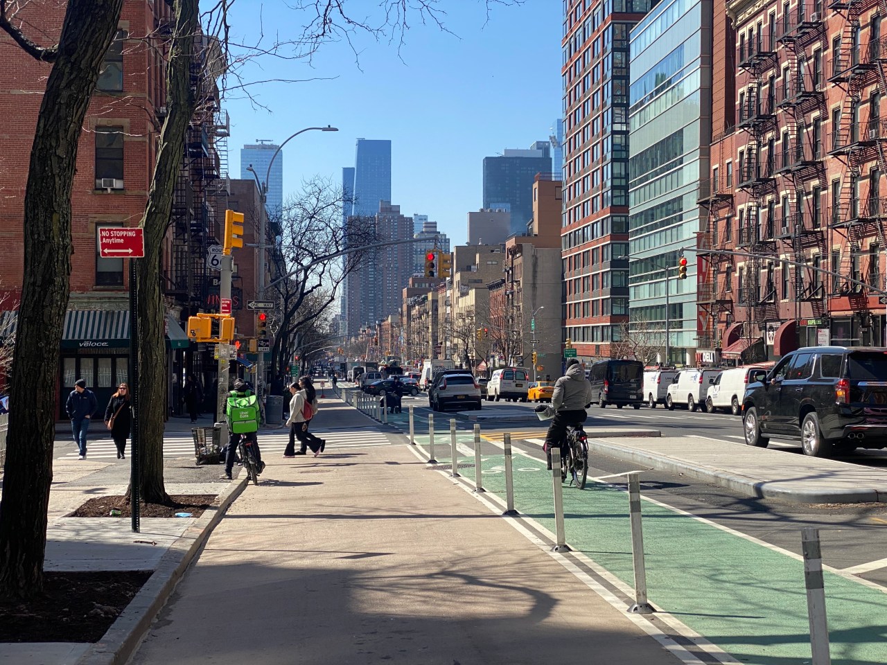The painted extensions add 11 feet of space for pedestrians on the once-crowded avenue. Photo: Kevin Duggan