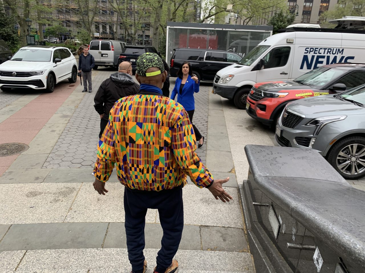 Pace confronted Rep. Nicole Malliotakis (blue dress) about why she parked on the plaza next to his monument.