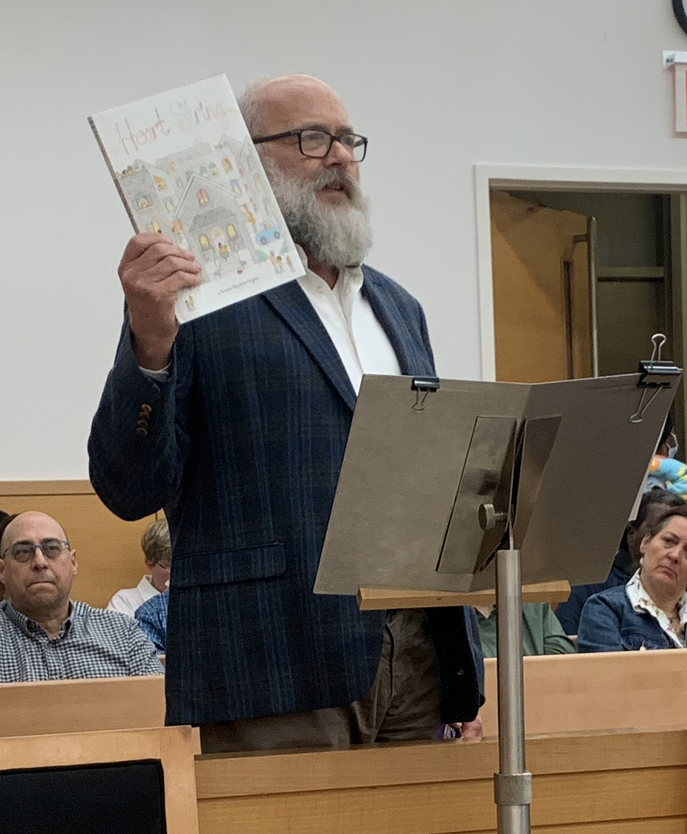 Jensen's cousin John Ogren also spoke angrily at Witherspoon and showed off a big tribute to the beloved teacher.