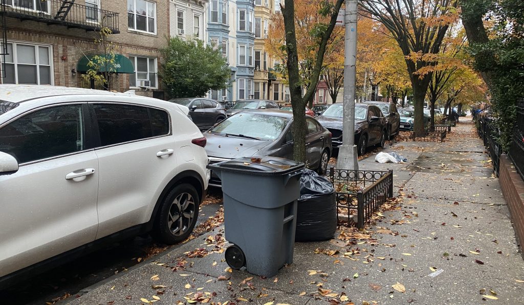 Cars Still Get in the Way of Containerized Trash Pickup