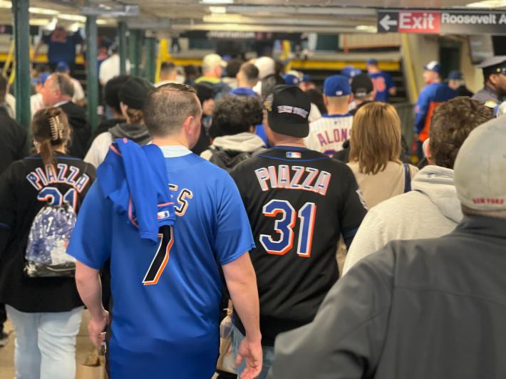 Mets fans walk through the No. 7 line stop at Mets-Willets Point toward CitiField for the home opener on April 4, 2025.