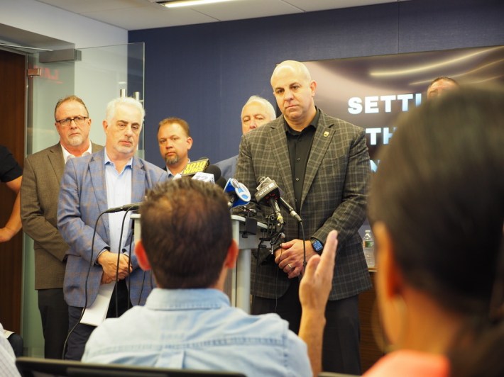 Kevin Sexton, a top official at the Brotherhood of Locomotive Engineers and Trainmen, listens to a question from a reporter at a press conference near Penn Station in September 2025.